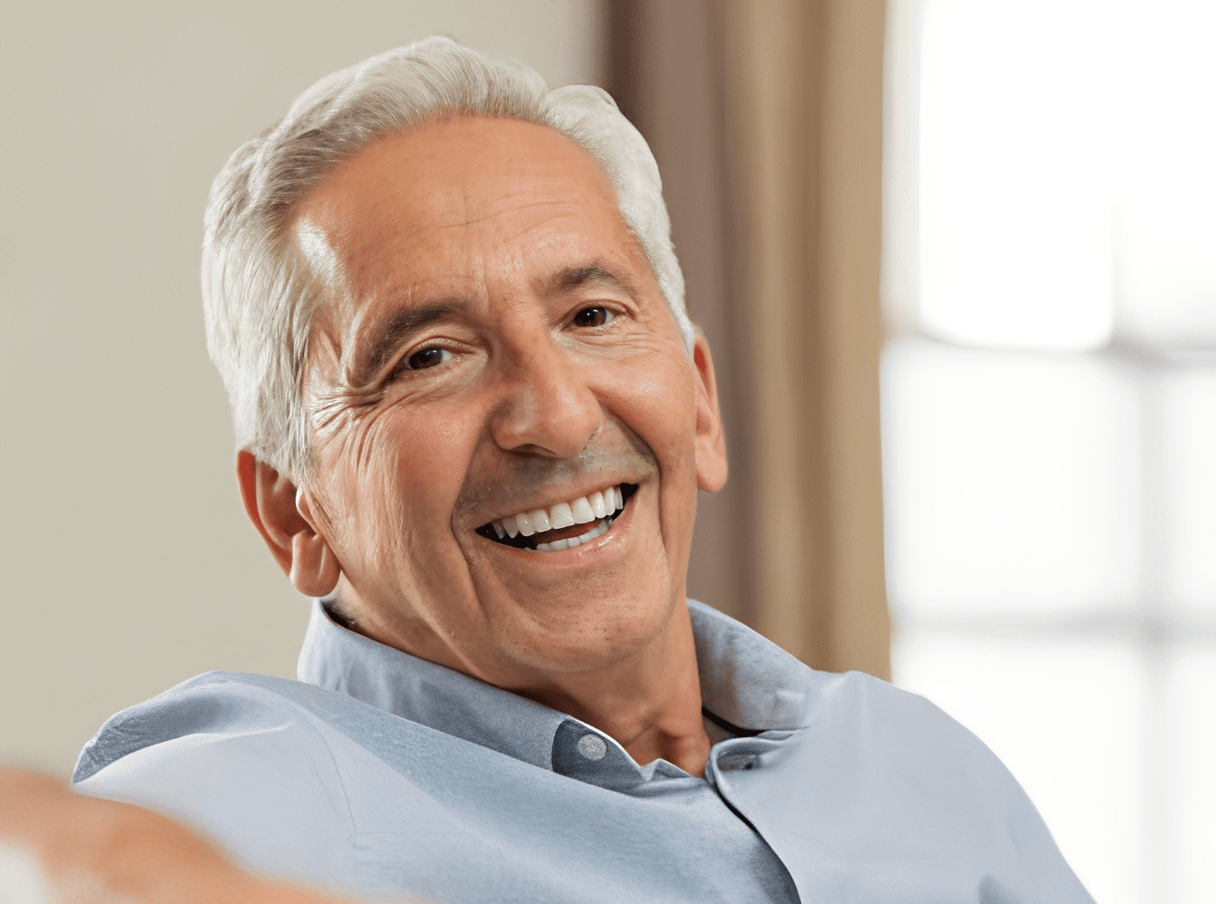 Happy senior man relaxing at home